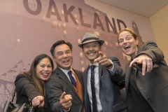 _____, Pelayo Llamas, Vincent Tong and Renee Ross pointing