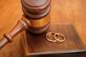 Family Law Dissolution - Gavel and rings