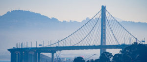 bay bridge oakland with light fog mist.